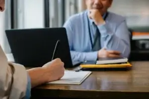 Two professionals during an interview, showing how to hire in Serbia without setting up a company