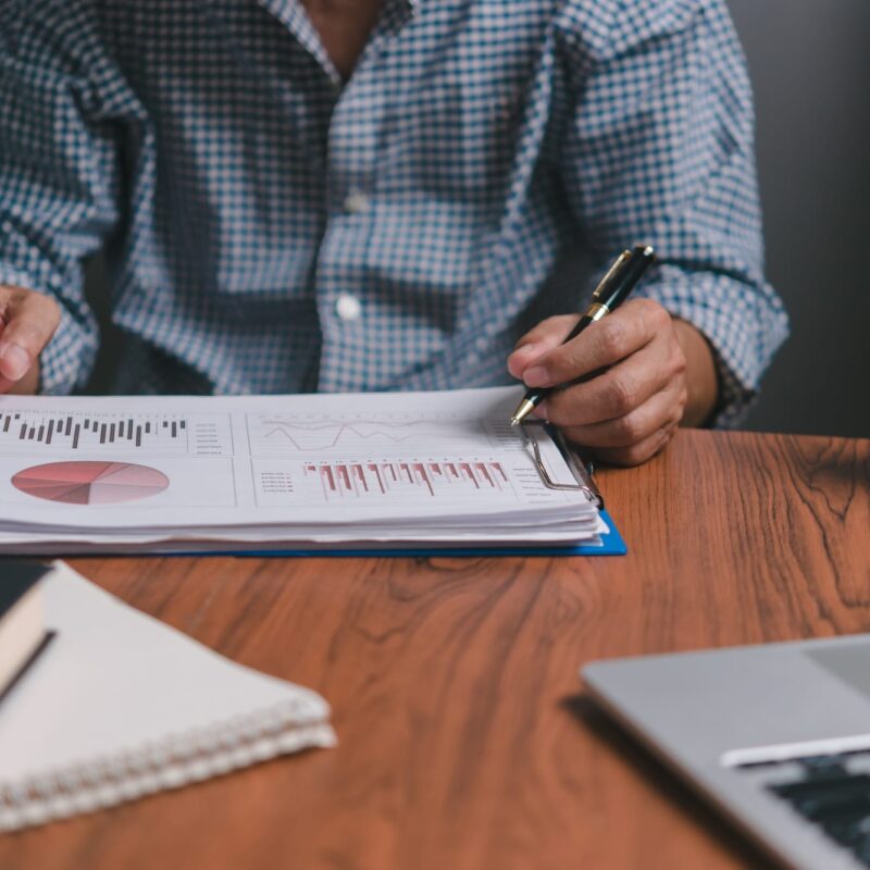 Businessman analyzing investment growth charts Businessman analyzing investment growth charts