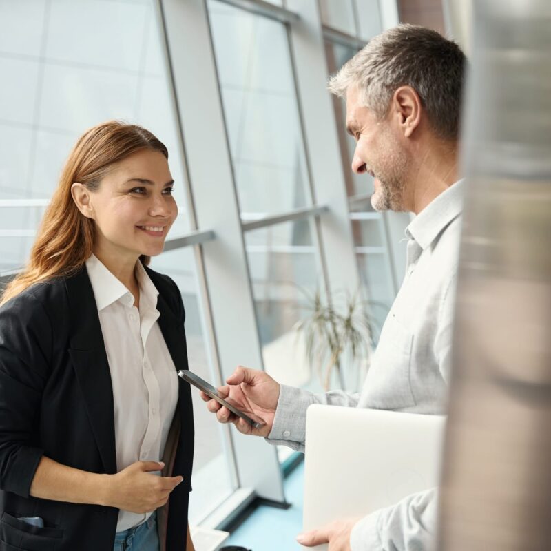 Employees of a financial company communicate at the window Employees of a financial company communicate at the window