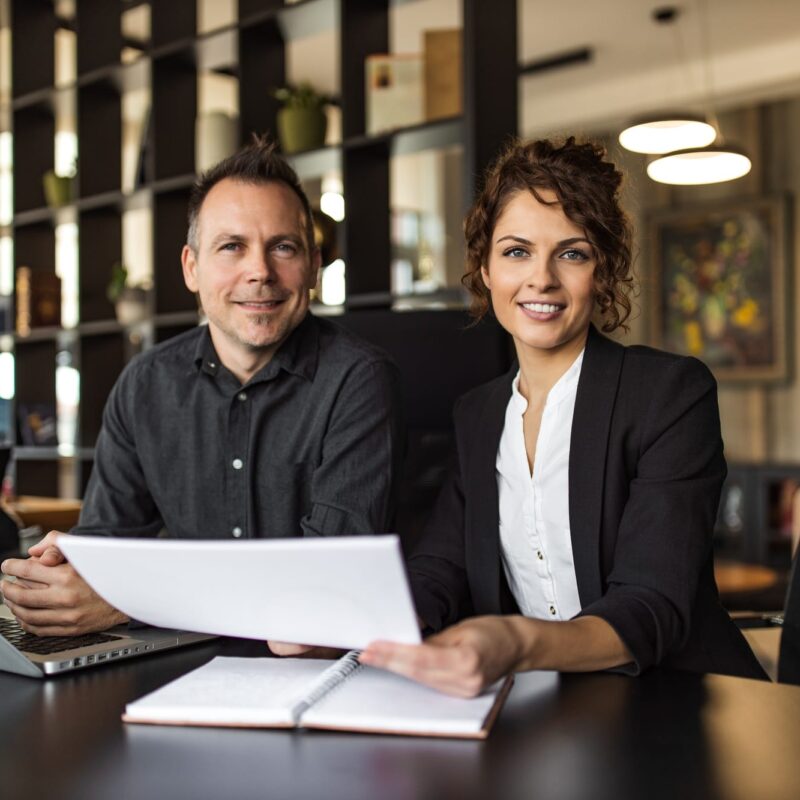 Portrait of a two cheerful HR managers at work. Portrait of a two cheerful HR managers at work.